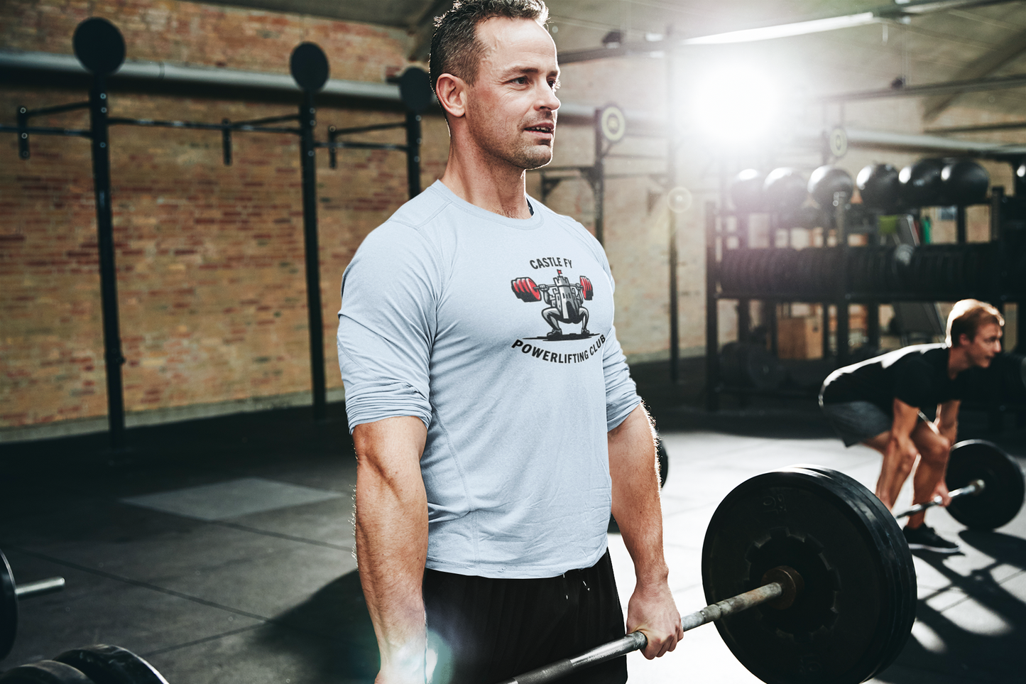Powerlifting T-shirt featuring the Castle FY Foundation logo in Light Blue, easy-going, high-quality gym wear.