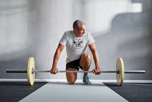 Powerlifting T-shirt featuring the Castle FY Foundation logo in Sport Grey, designed for durability and composed presence.