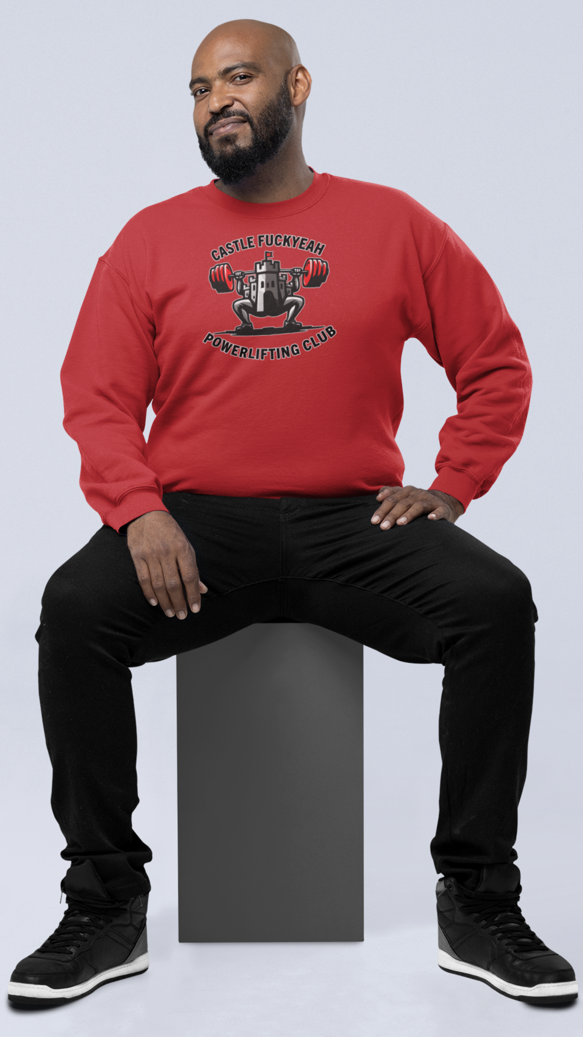 Red Heritage jumper featuring the Castle FY powerlifting logo across the chest.
