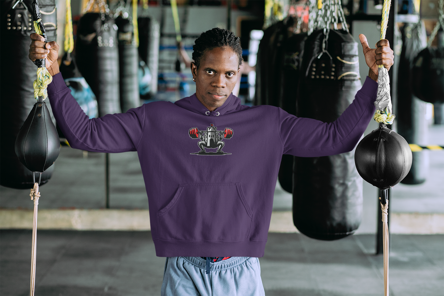 Powerlifting hoodie featuring the Castle FY Iconic logo in Purple, strength apparel with distinct character.